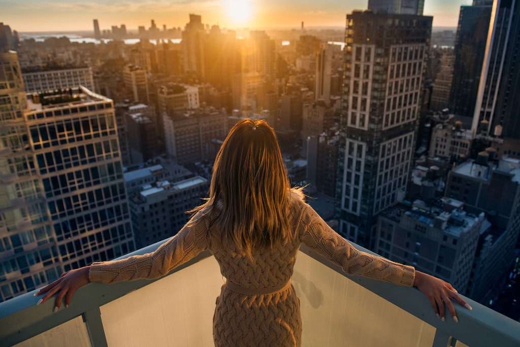 Woman in NYC balcony Woman in NYC balcony
